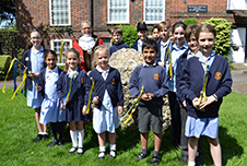 The Mayor of the City and District of St Albans, Councillor Mohammad Iqbal Zia, pictured with pupils from St Michael’s Primary School at the Pudding Stone.