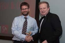 Luke Godfrey being presented with the sustainability award by Cllr Read.