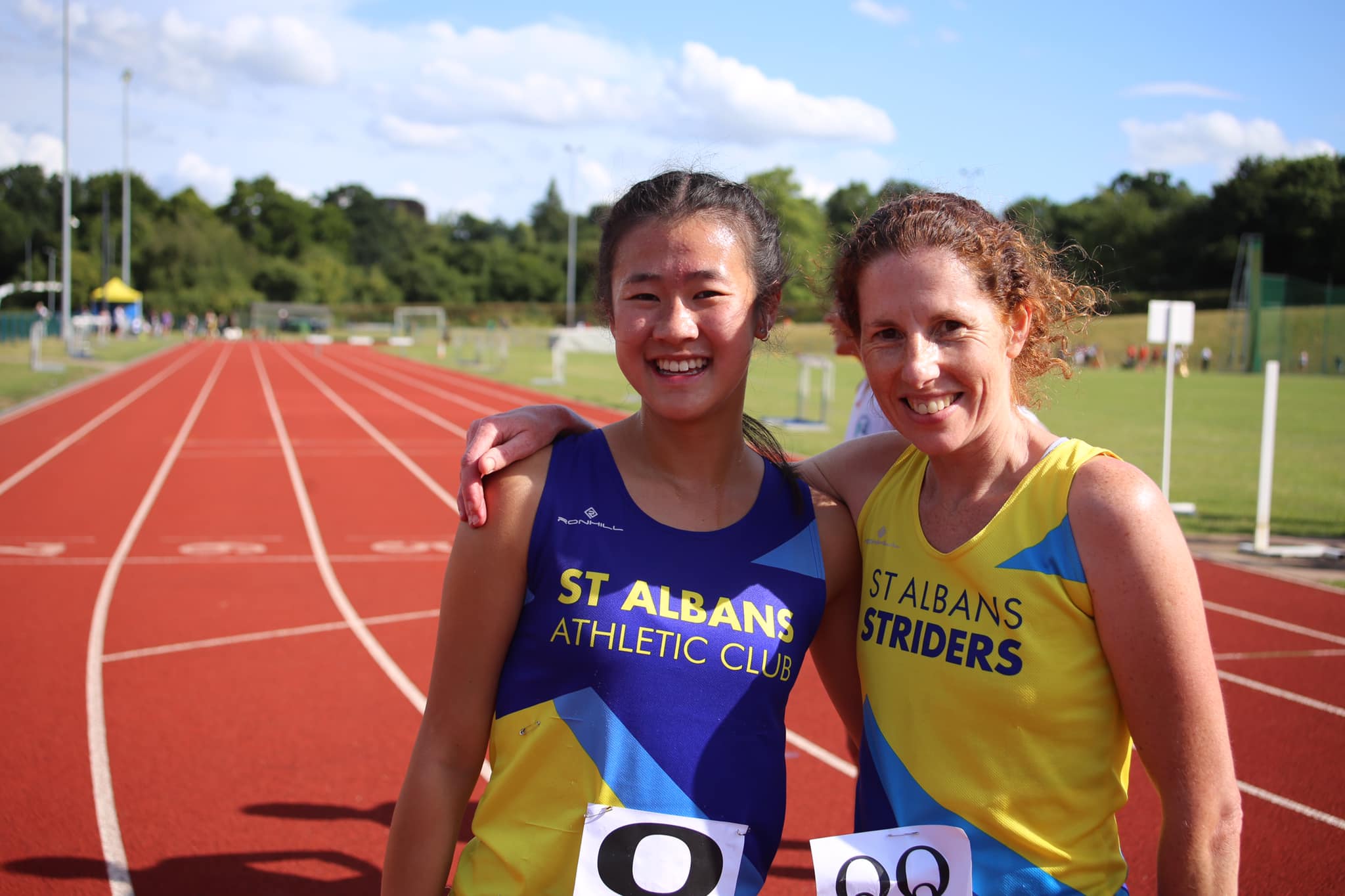 Team mates Lily Tse (left) and Kate Dixon compete at the Abbey View Community Athletics Track
