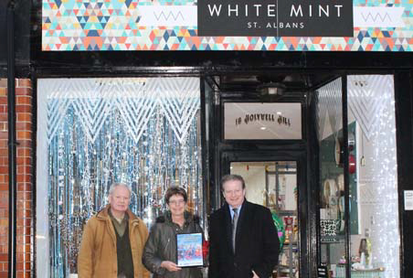 The judges outside White Mint, runner-up in the best festive display category.