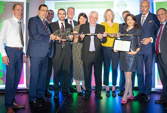 Cllr Brewster, third from right, accepts the award with the project team.