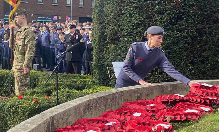 A person in uniform standing in front of a group of people

AI-generated content may be incorrect.