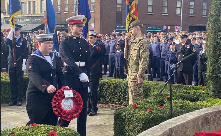 A group of people standing in a line

AI-generated content may be incorrect.