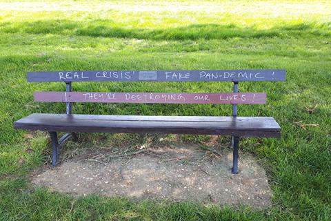 A defaced bench