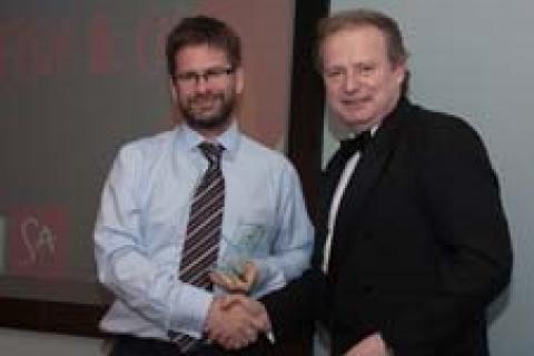 Luke Godfrey being presented with the sustainability award by Cllr Read.