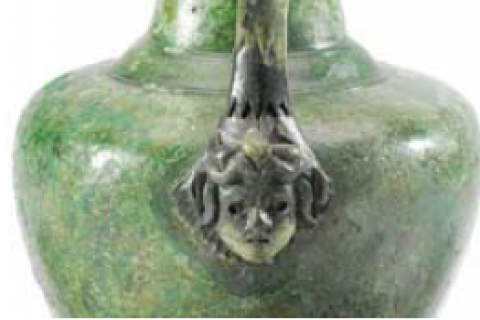 Medusa head on a burial jug found at the Turners Hall Farm site.