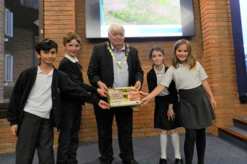 The Mayor, Councillor Geoff Harrison, presents The Wilder Award to pupils from Roundwood Primary School