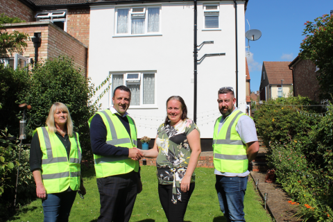 Cllr Jacqui Taylor, 3rd from left, shakes hands on the £18 million deal with CCS’s Danny Gladwyn, 2nd from left, at the Breakspear Avenue property with, far left, Tina Harvey, CCS’s Senior Resident Liaison Officer, and, far right, James Kendrick, CCS’s Retrofit Site Supervisor.