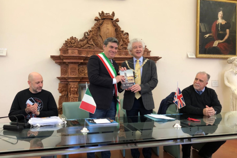 Cllr Rowlands, Mayor of St Albans City and District, 2nd right, presents his gift to Fano Mayor, Massimo Seri