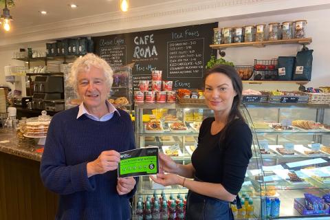 Councillor Anthony Rowlands presents a five-star food hygiene certificate to Cafe Roma owner Velina Grudeva