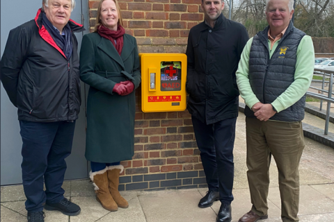 from the left; examining the new defibrillator are John Turkentine, Vice-President and Coach of Batchwood Hall Golf Club; Councillor Helen Campbell, Lead for Leisure; James McNulty, Everyone Active’s Contract Manager; and Richard Sullivan, Club Captain of Batchwood Hall Golf Club.